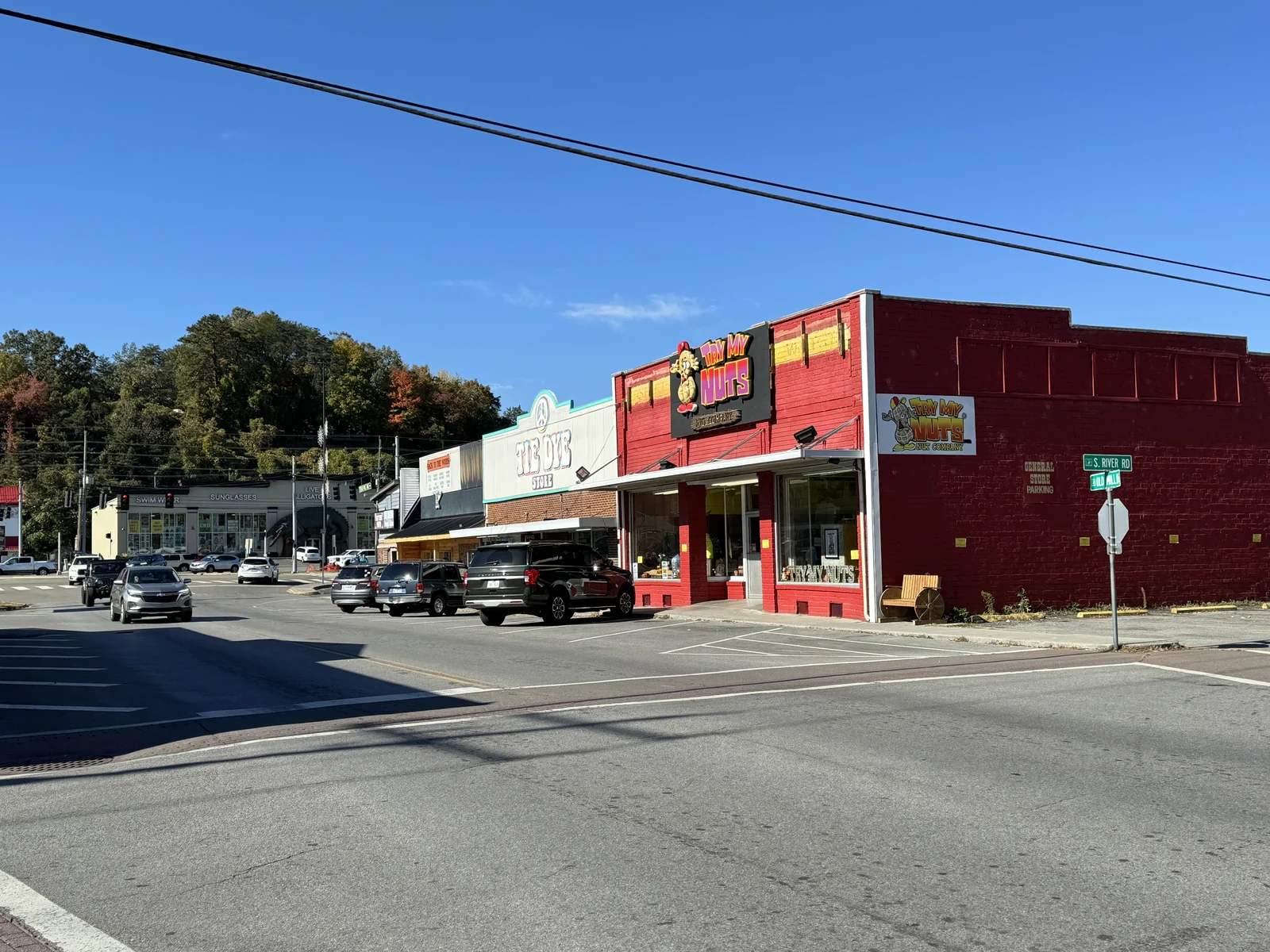 Storefronts and a marked crossing at South River Road and Old Mill Avenue in Pigeon Forge